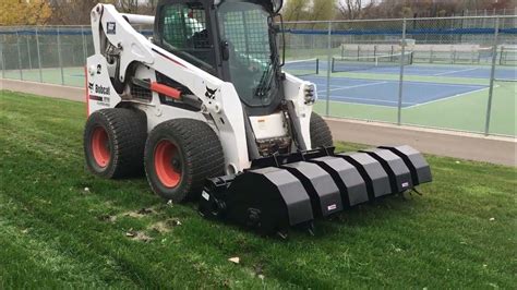 skid steer aerator|cat 299 skid steer attachments.